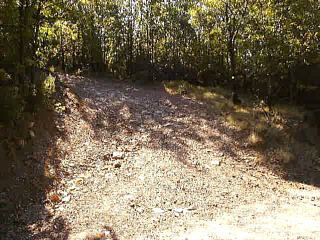 Go up this gravel road to reach the path to the monument